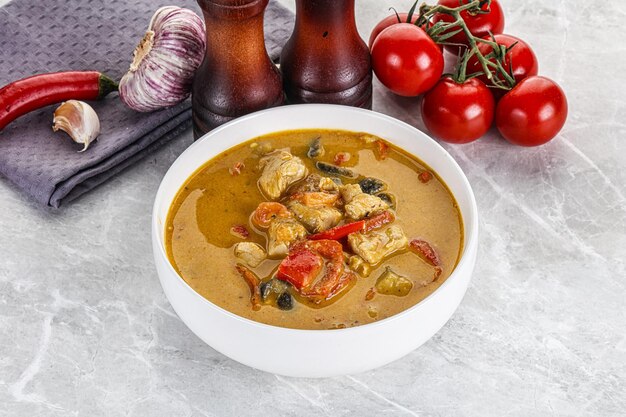 Traditional yellow Thai curry with chicken