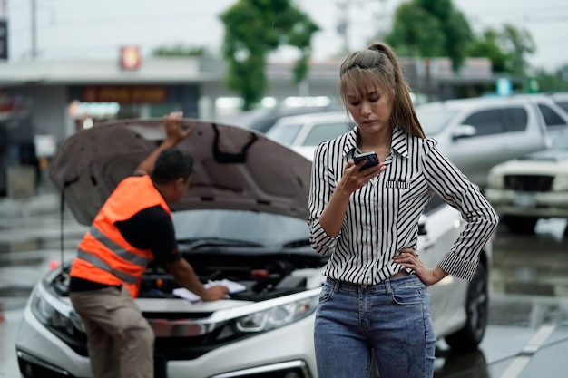 Photo traffic accident insurance agent inspects damaged vehicles and submits a postaccident claim report insurance concept