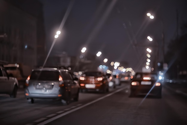 traffic of cars in the night city, view from the car, lights abstract auto background