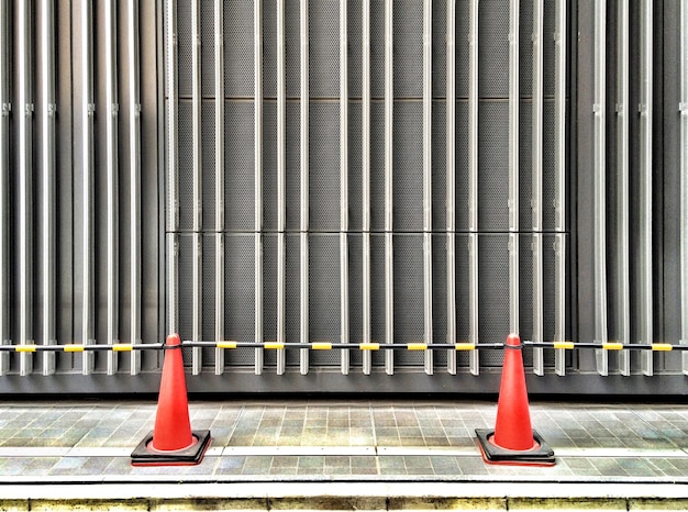 Photo traffic cones near wall