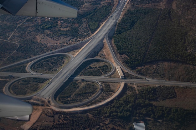 Traffic junction road junction daytime view from above with circular road Top down view of the road