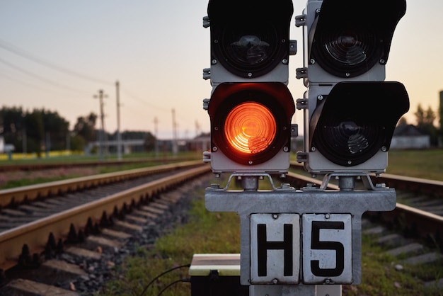 Traffic light show red signal on a railway, close up