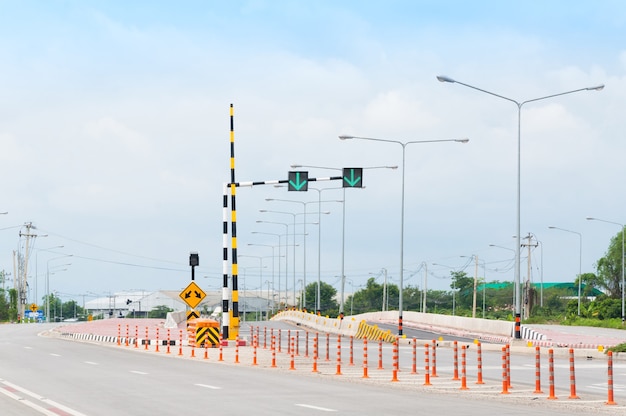 Traffic light signal, road markings and pass either side