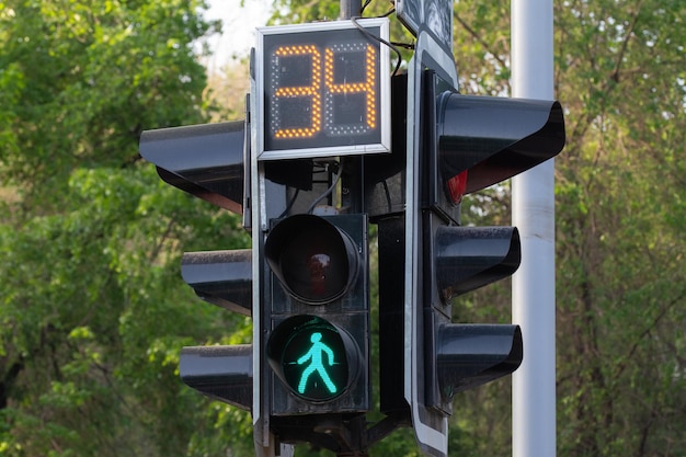 Traffic light with a buming sign for pedestrians