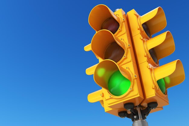 Traffic light with green color on blue sky background