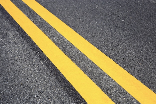 Traffic line on road with texture background.