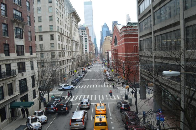 Traffic on new york city street amidst buildings