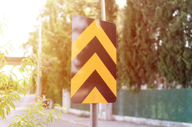 Traffic safety signs on city street road. direction movement sign outdoor. danger warning symbol on urban way for transport automobile and car. control and regulate drive in town path. flare