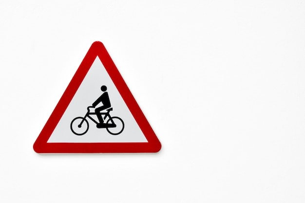 Photo traffic sign - danger bicycles - on white background.