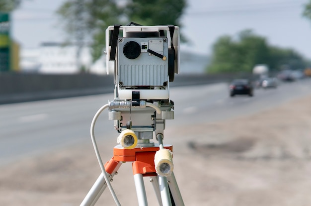 Traffic speed control camera radar installed by side of the road video camera is recording