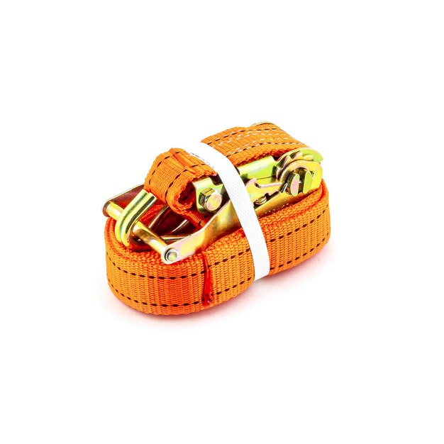 Photo trailer strop or strap in orange nylon and metal tie isolated over white background ratchet straps for cargo load control cargo restraint strap