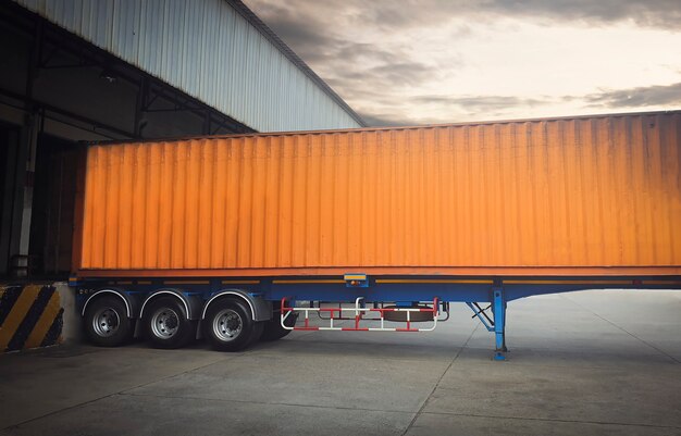 Trailer truck parked loading at dock warehouse cargo shipment\
freight truck transportation logistics