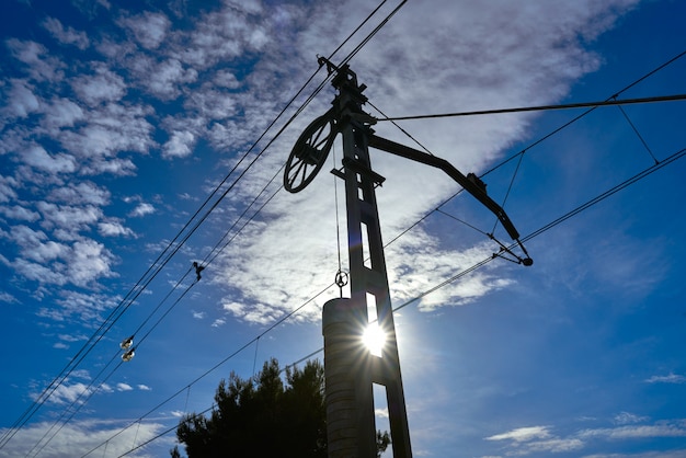 Train cables counterweight under blue sky 