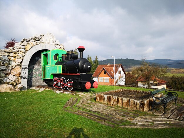 Train on field against sky