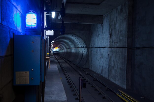 Photo train in illuminated tunnel