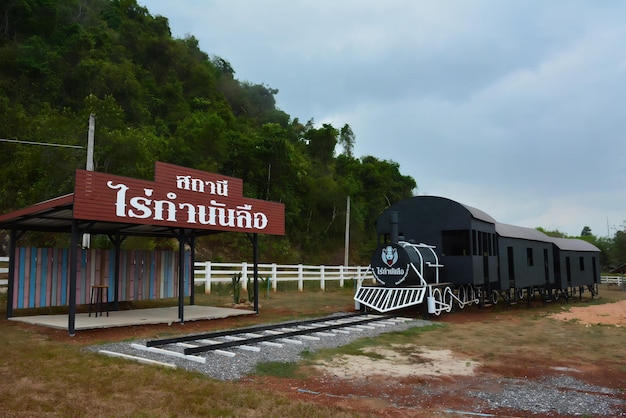 A train is passing by a sign that says'i'm not old '