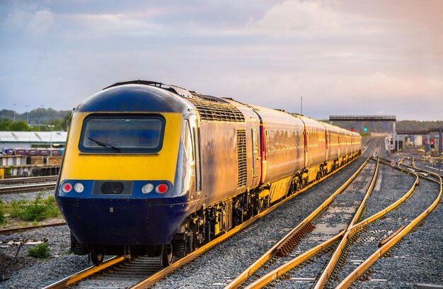 Train at railroad track against sky