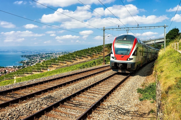 Train at Vineyard Terrace of Lavaux at Lake Geneva and Swiss Alps, Lavaux-Oron district, Switzerland