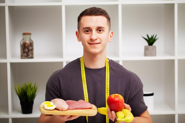 Trainer consumes a high-protein meal of meat and fruits.