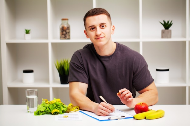 Trainer draws up a training program and a healthy diet plan.