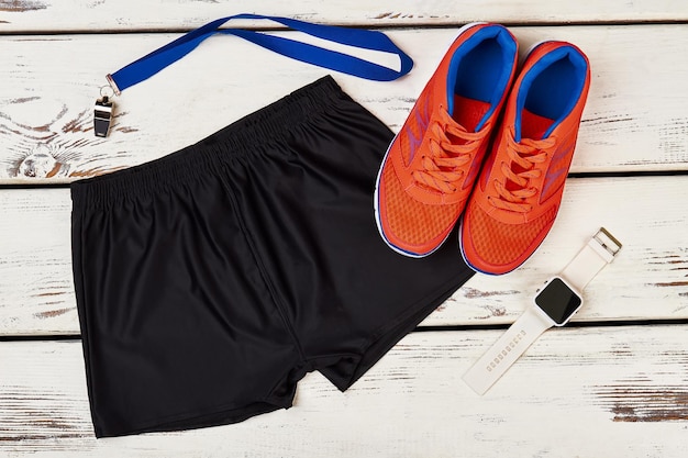 Premium Photo | Trainer's sportwear and smart watch