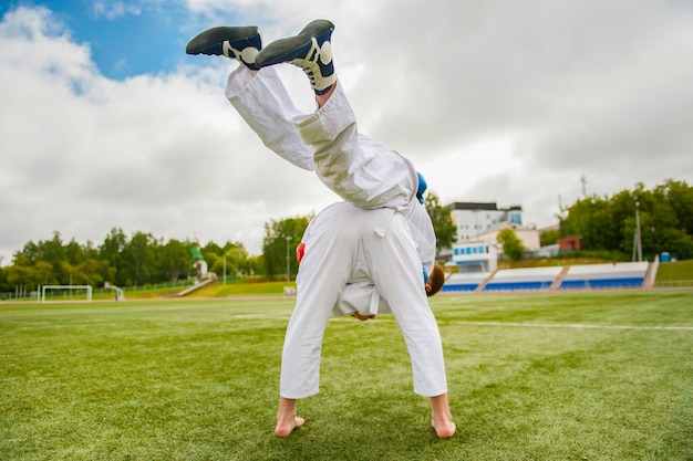 training of athletes on a green field in summer