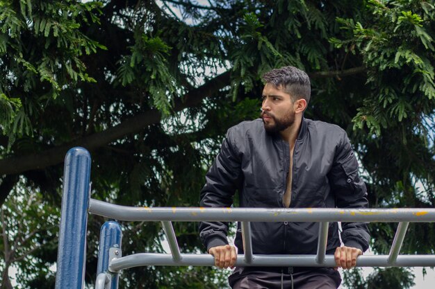 Photo training of a young man in a park on the street of a city