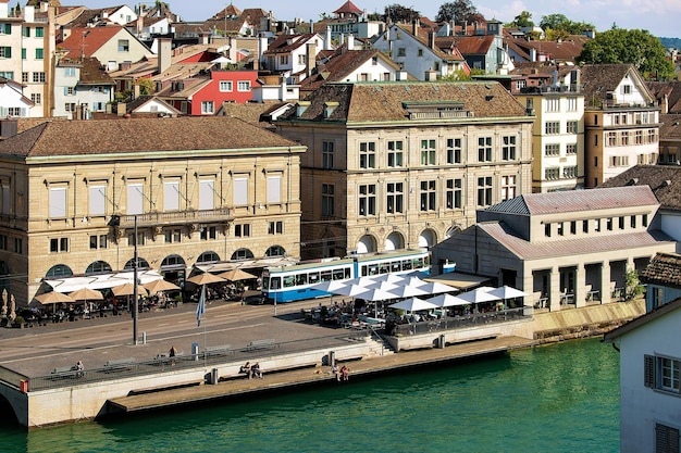 Tram at Limmatquai in Zurich city center, Switzerland. People on the background. Seen from Lindenhof hill