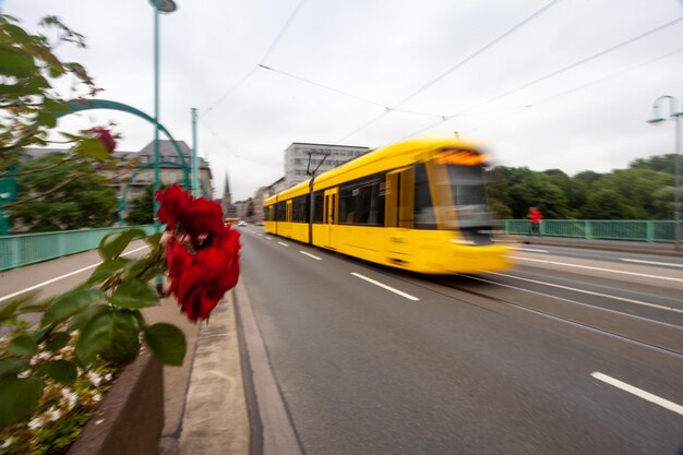 Tram in motion in the city streets blurred