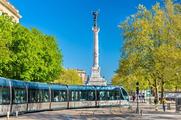 Tram near the monument aux girondins in bordeaux - france, aquitaine