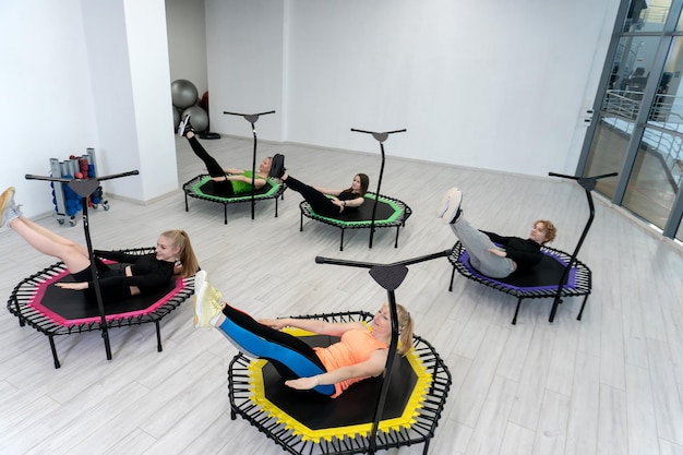Trampoline for fitness girls are engaged in professional sports the concept of a healthy lcenter