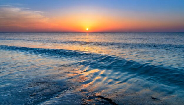 Tranquil sunset a golden glow over blue waters