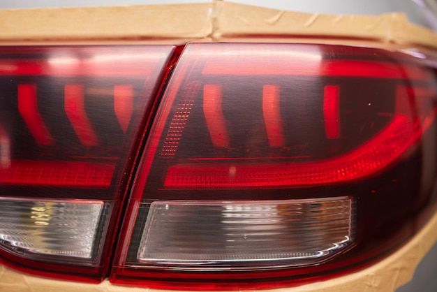 Photo transformative before and after shots of tail light repainting on a car