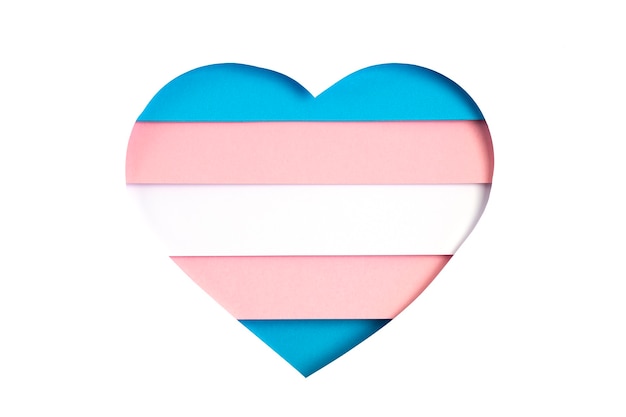 Photo transgender flag in the form of paper cut out shape with blue, pink and white colors. love, pride, diversity, tolerance, equality concept
