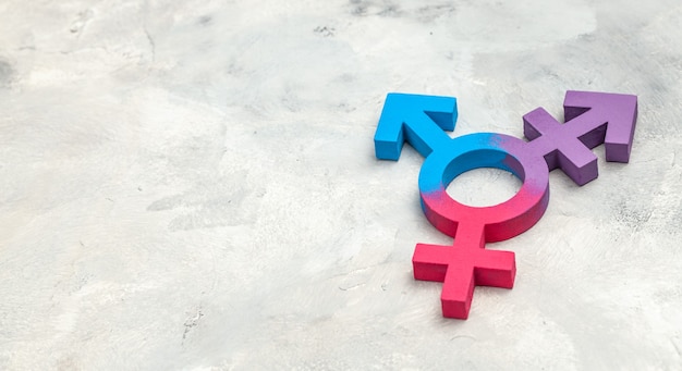 Transgender symbol and gender symbol of man and woman on a gray background.