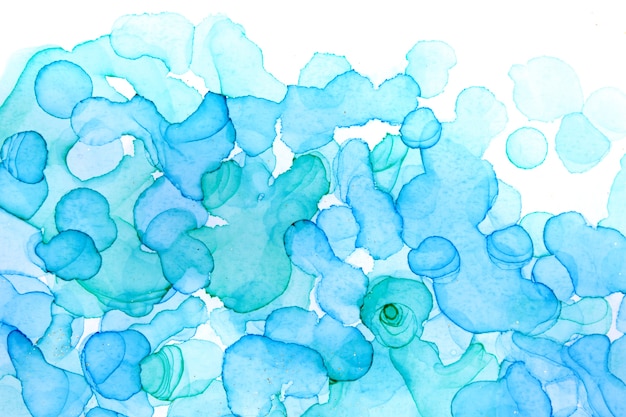 Transparent blue handdrawn watercolor drops on white background. Bubbles imitation.