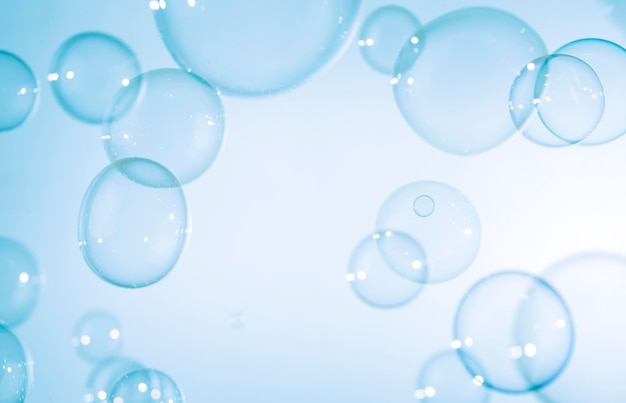 Transparent ˌBlue Soap Bubbles on White Background