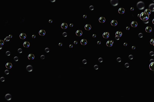 Photo transparent bubbles soap pattern overlay abstract particles splashes of water on black