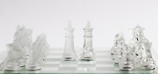 Photo transparent chess pieces on board