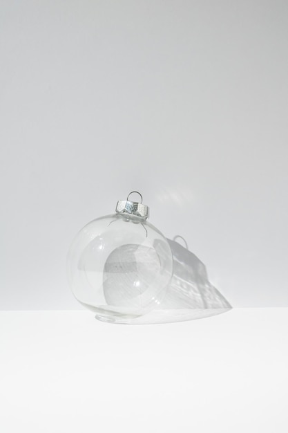 Transparent Christmas bauble decoration on white background Minimal New Year concept