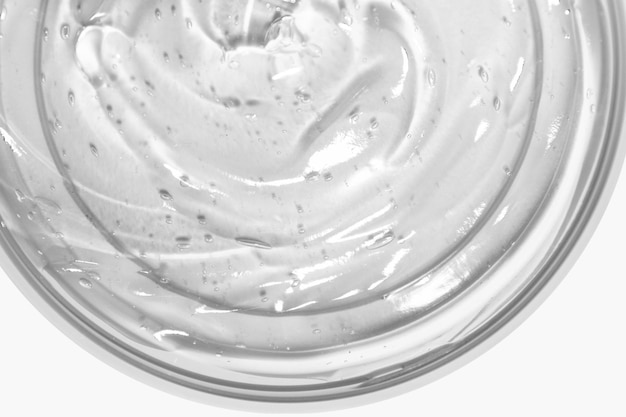 Transparent cosmetic gel in a round jar View from above On an light background