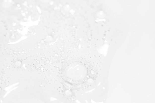 Transparent gel or liquid with bubbles on a light background