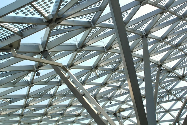 Transparent glass dome roof of modern design style pavilion building with geometric metal constructi