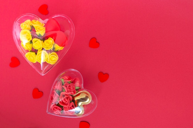 Transparent heart with yellow and burgundy roses in low poly style isolated on red background Valentines day and mothers day concept with copy space