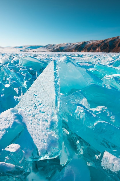 Transparent ice floes on Baikal lake at sunset Selective focus Baikal Siberia Russia Winter landscape