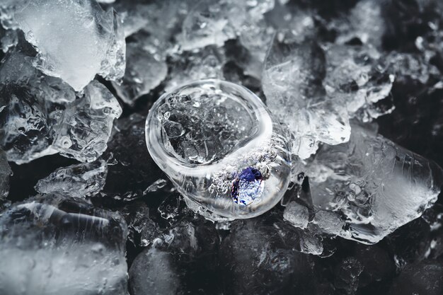 Transparent icy rings made from glass in ice and water