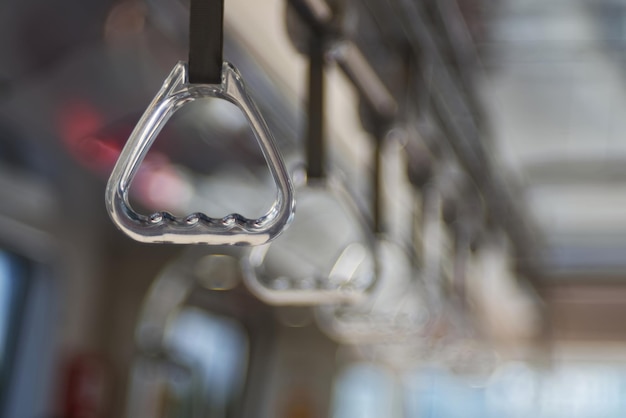 A transparent plastic handrail in a train bokey