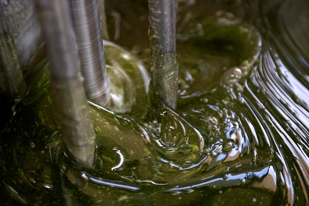 Transparent viscous green gel is forming in a homogenizer