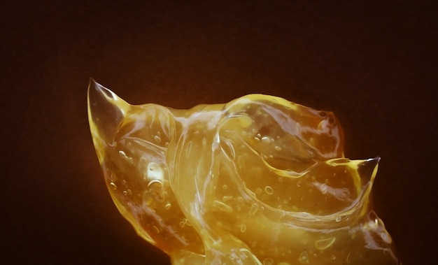 Прозрачный желтый мазок крема для лица или золотистого меда