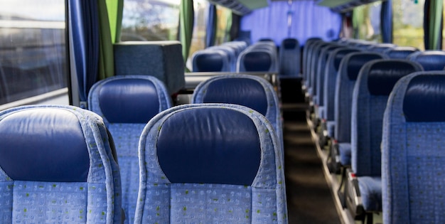 Photo transport, tourism, road trip and equipment concept - travel bus interior